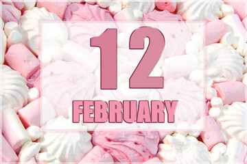 calendar date on the background of white and pink marshmallows. February 12 is the twelfth day of the month