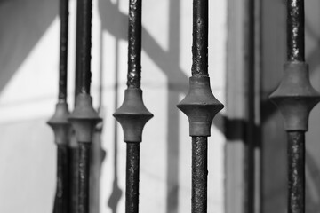 Vintage metal fence in black and white.