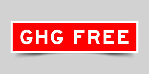Sticker label with word GHG (Abbreviation of greenhouse gas) free in red color on gray background