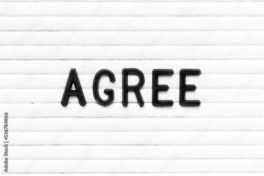 Wall mural Black color letter in word agree on white felt board background