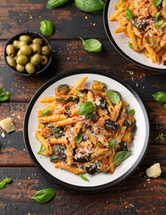 Zucchini penne pasta with parmesan cheese, basil and tomato. Healthy food