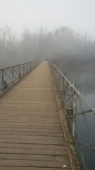 Fototapeta premium A mistically misty bridge in Northern Italy