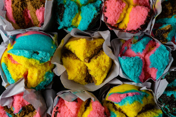 colour full traditional steam cup cake, indonesian bolu kukus on black plate
