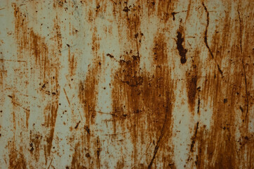 abstract grunge background: peeling paint on rusty iron