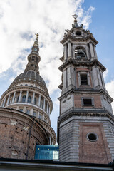 San Gaudenzio Dome and Bell Tower, symbol of Novara. Blue sky and clouds in background. Portrait view.