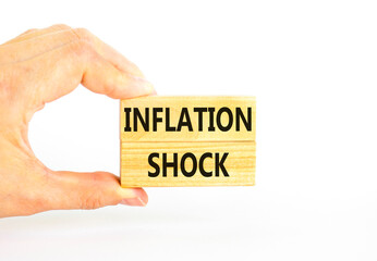 Inflation shock symbol. Concept words Inflation shock on wooden blocks. Beautiful white table white background. Businessman hand. Business inflation shock concept. Copy space.