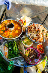 Snack at break time. Famous Vietnamese food is Banh mi thit, popular street food from bread stuffed with raw material: pork, ham, pate, egg and fresh herbs