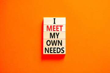 I meet my own needs symbol. Concept words I meet my own needs on wooden blocks. Beautiful orange table orange background. Business and i meet my own needs concept. Copy space. - obrazy, fototapety, plakaty