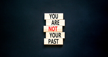 You are not your past symbol. Concept words You are not your past on wooden blocks. Beautiful black...