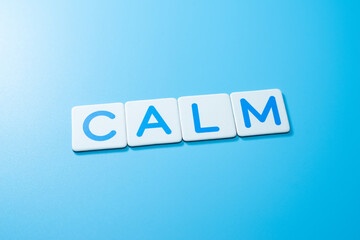 Word CALM over a blue background,CALM Concept