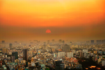Sunset with Smog Air pollution in Ho Chi Minh City Vietnam from the highest building