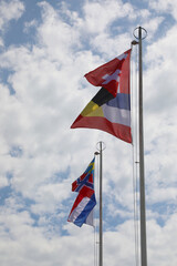 international flags on the flagpole waving during the meeting