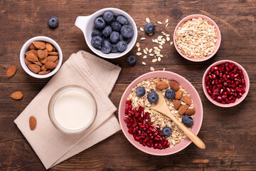 healthy eating concept with whole grains fresh fruit and almonds. - obrazy, fototapety, plakaty
