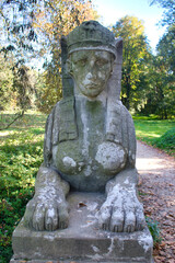 Fototapeta na wymiar Detail of sphinx face statue. Veltrusy chateau. Czech Republic. 