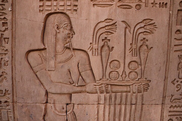 Fototapeta na wymiar Offerings presented to God: Beautiful ancient egyptian carvings at Kom Ombo temple in Aswan 