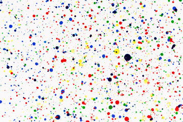 Paint splatters on bright material. Watercolor on white paper.