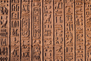 Ancient egyptian hieroglyphics carved on Kom Ombo temple in Aswan, Egypt 