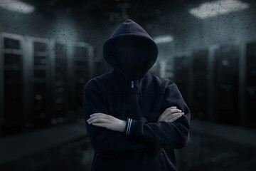 A hacker stands in a server room .