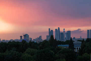 Fototapeta na wymiar Panorama from Moscow city. Purple sunset sky. Sunset view of the city in the distance.