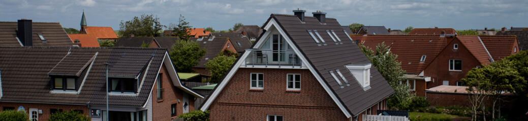 Fototapeta na wymiar Tiled roofs of houses in Germany
