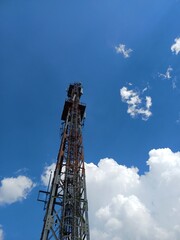 Fototapeta na wymiar Mobile Tower with cloudy Background 