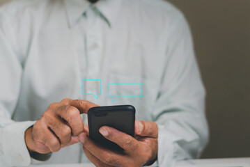 Man using smartphone to typing, live chat social media marketing technology concept and  using of social networks, chating conversations and working  at home.