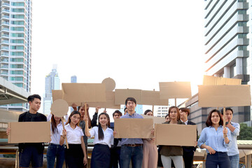 Crowds of discontented people holding blank banners placards protesting at downtown city, group of...