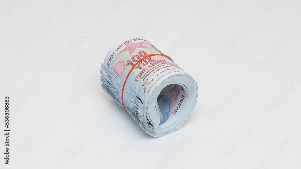 Wall mural hundred turkish liras rolled up with rubber band on isolated white background