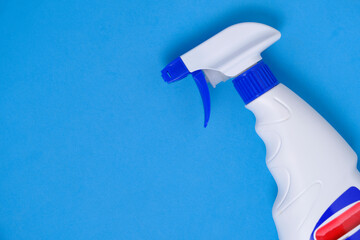 Sprayer for washing windows and plumbing blue background.