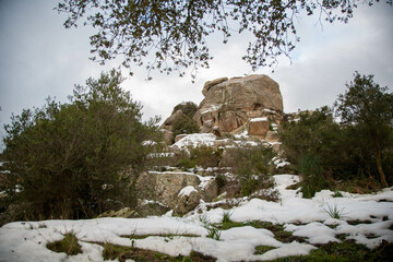 Gallura's iconic granite formation surrounded by snow