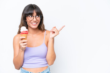 Young caucasian woman with a cornet ice cream over isolated white background intending to realizes the solution while lifting a finger up