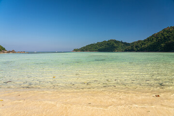 Beautiful Mai Ngam beach and shallow water coral reef in Surin island national park, Pang Nga, Thailand.