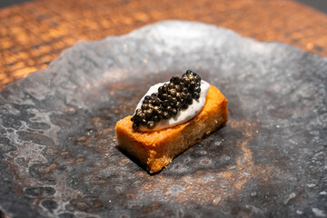 Luxury caviar toast with truffle cream sauce