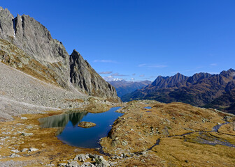 Naklejka na ściany i meble Alpine Lake - Lago delle Pigne