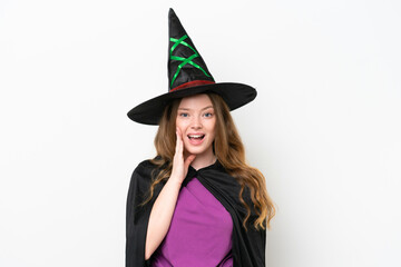 Young pretty woman costume as witch isolated on white background with surprise and shocked facial expression