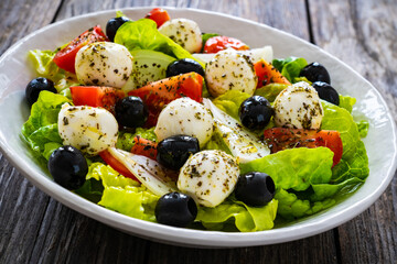 Mozzarella salad on wooden board
