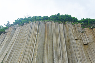 basalt columns forming a coastal rock at Cape Stolbchaty on Kunashir Island