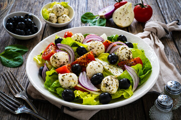 Mozzarella salad on wooden board

