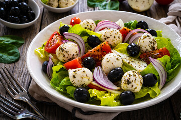 Mozzarella salad on wooden board
