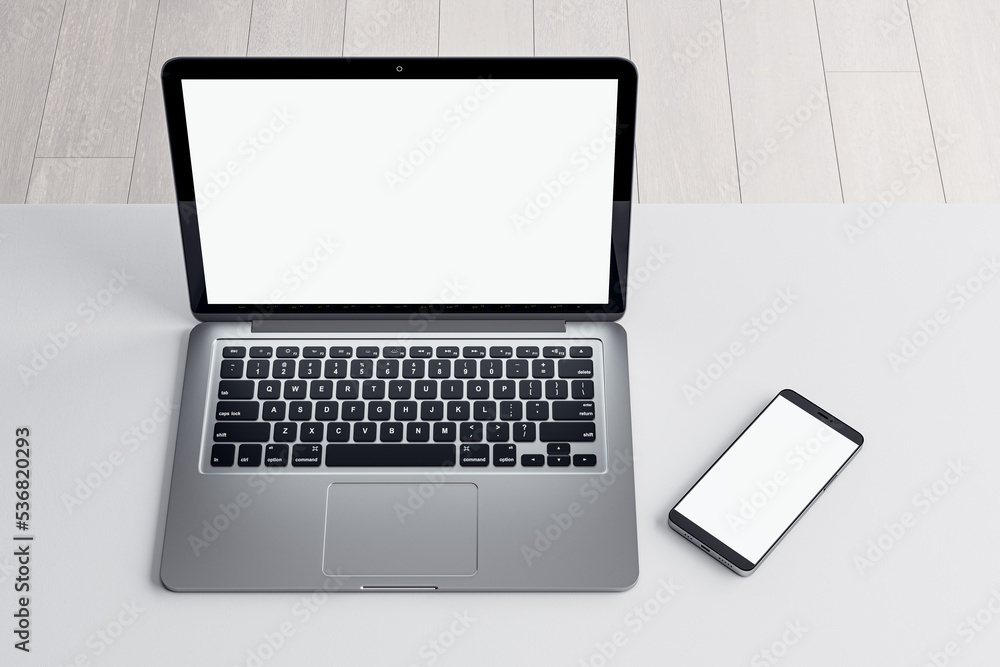 Poster close up of empty white laptop and cellphone on light desktop, mock up place on screen, wooden parqu