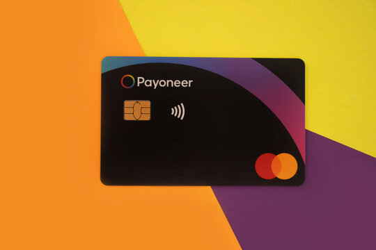 October 2, 2022 Ukraine city Kyiv payment card Payoneer Mastercard on a colored background