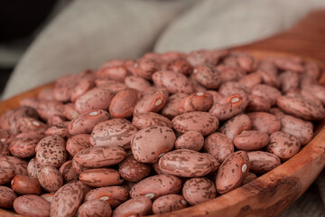 black dry  bean in the wooden spoon