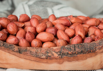Closeup Peanuts-Groundnut ,wooden bawl On Background