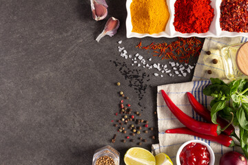 Vegetables with herbs and spice at stone background table. Natural healthy homemade food concept