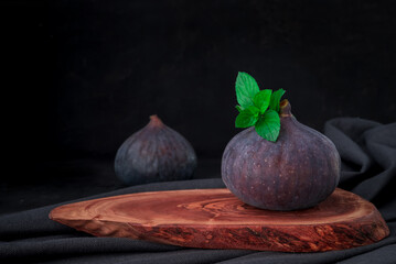 Fresh sweet fruit figs on a dark background
