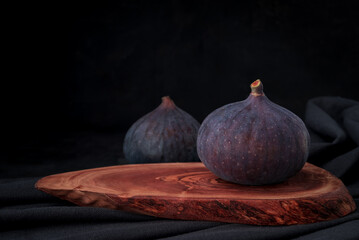 Fresh sweet fruit figs on a dark background
