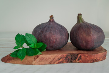 Fresh sweet fruit figs on a wooden board