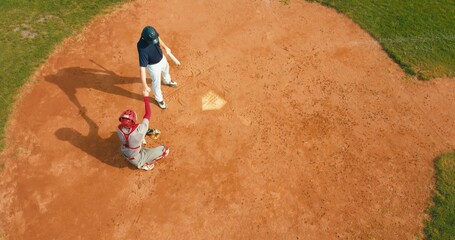 OVERHEAD Baseball player batter greets catcher and prepares to receive a ball from pitcher