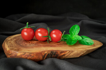 red  tomatoes branch on table  background, healthy food