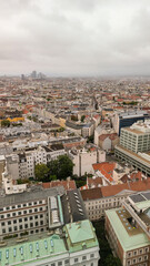Vertical aerial view of Vienna, Austria. Central streets and buildings from drone on a cloudy day
